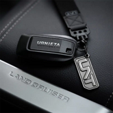Full view of the URNIETA key fob kit with buttons and logo detailing, designed specifically for Prado 250 models.